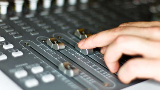 sound mixing board in a recording studio