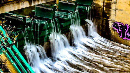 water flowing through a dam