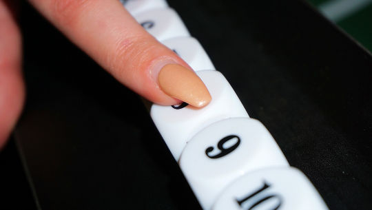 finger pointing at a single-digit number