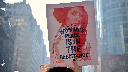 a poster that reads: A woman's place is in the resistance.