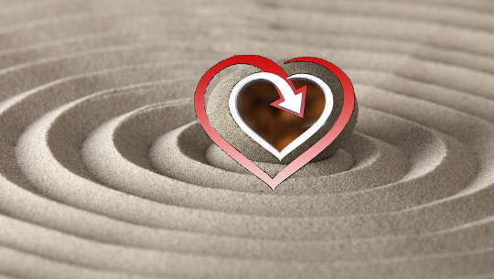 heart overlaid on a perfect sand circle with its waves expanding to infinity