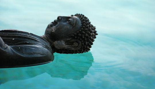 buddha floating on water