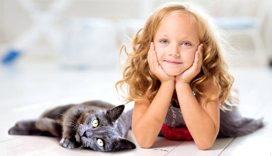 young girl with a cat