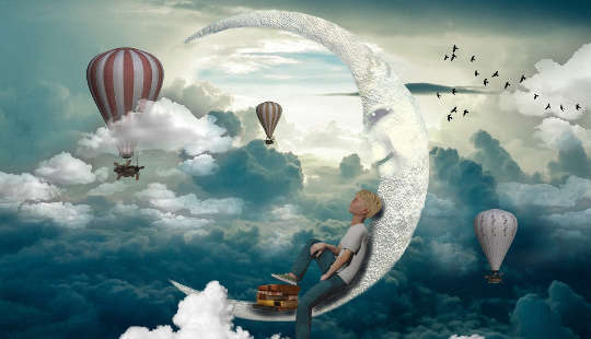a young boy sitting on a crescent moon in the sky surrounded by hot air balloons and birds